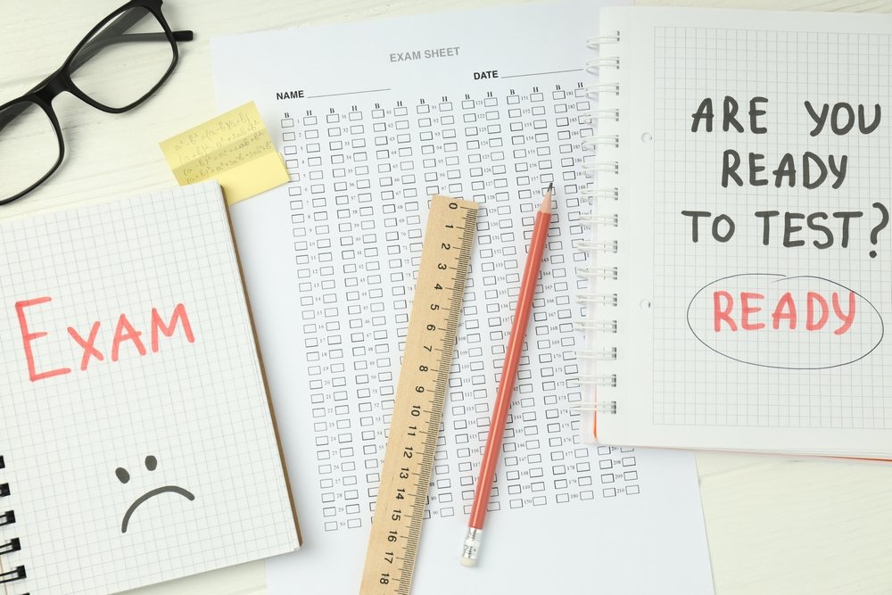 TEAS Preparation Timeline study concept featuring exam sheets, notebooks, glasses, and study materials, representing a structured TEAS exam preparation plan for first-time test takers.